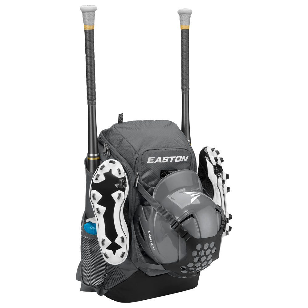 The gray Easton Walk Off NX Backpack (A159059) holds two bats, a helmet, cleats, and a water bottle in its side mesh pocket. It features multiple compartments and padded shoulder straps for comfortable gear transport.