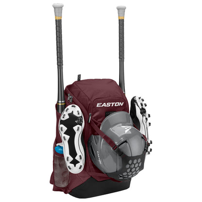 The Easton Walk Off NX Backpack (A159059) in maroon holds two bats, a water bottle, gray cleats, and a gray helmet on the outside. It features multiple compartments and mesh side pockets for easy organization.