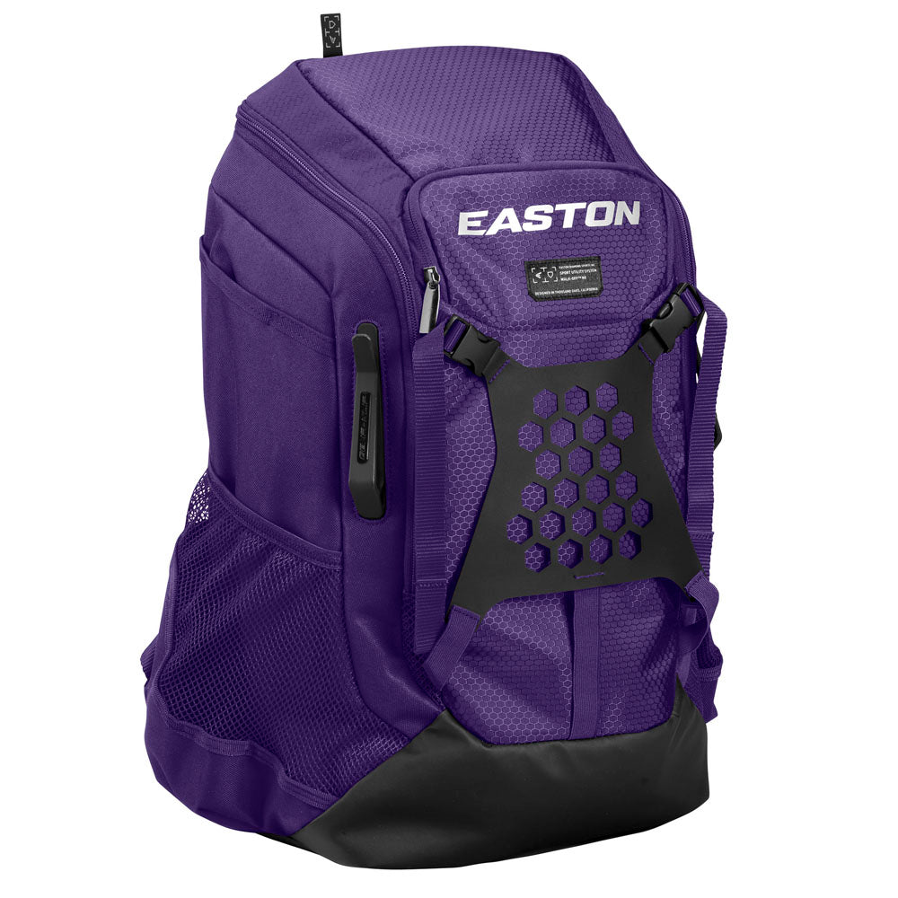 The Easton Walk Off NX Backpack (A159059) is a purple baseball backpack with a black base, mesh side pockets, front zippered pocket, and honeycomb-patterned front panel. The white Easton logo appears on the top front.