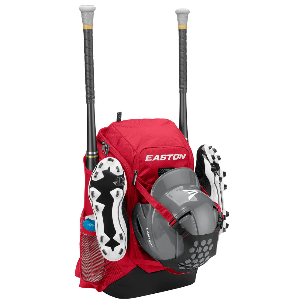 The red Easton Walk Off NX Backpack (A159059) holds two bats, cleats, a batting helmet, and a water bottle, keeping your gear organized and easily accessible in this versatile Easton equipment bag.