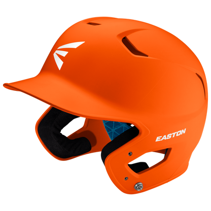 The Easton Z5 2.0 Grip Matte Solid Batting Helmet (Z52MT) features a bright orange finish, side ear protection, black interior padding, top ventilation holes, a visor, white Easton logos, and is NOCSAE certified.