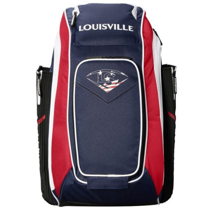 The Louisville Slugger Prime Stick Pack Backpack (WTL9902) features navy, red, and white colors, a front zippered pocket, white trim, and a logo with a diamond and baseball stitching above an American flag pattern.