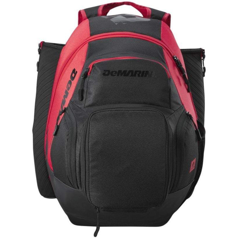 The DeMarini Voodoo OG Backpack: WB57117 features a black and red design with multiple zippered compartments, side pockets, and the DeMarini logo on the front—ideal for carrying all your baseball gear.
