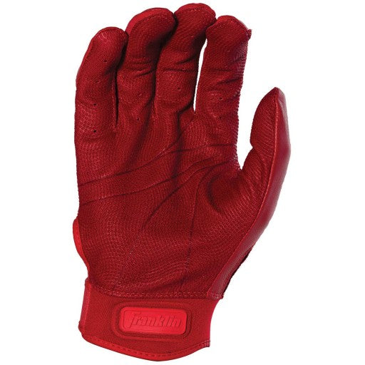 The Franklin CFX Pro Full Color Chrome Adult Batting Glove, shown palm up in red sheepskin leather, features textured details, curved fingers, a Velcro strap with Franklin branding, and delivers superior grip.