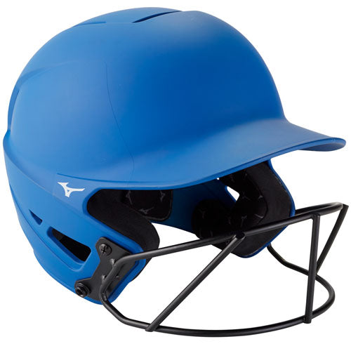A Mizuno F6 Solid Fastpitch Batting Helmet with Mask (380395 / 380397) is shown angled against a white background, featuring a blue finish, black face mask, ear protection, and ventilation holes.