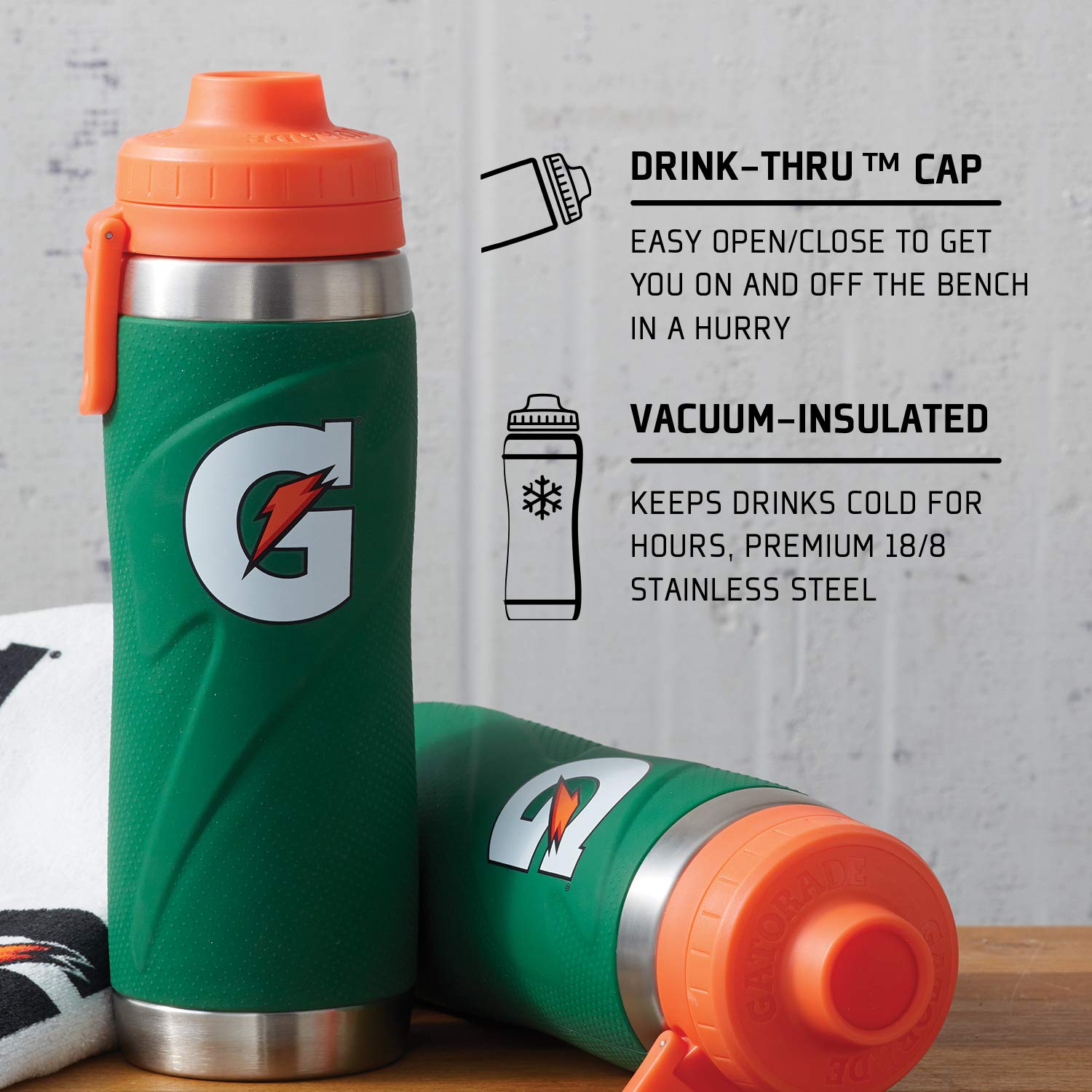 The Gatorade 26 oz Stainless Steel Water Bottle (43669) is shown upright and lying down, featuring a green and orange design, drink-thru cap for quick access, nonslip grip, and vacuum-insulated build to keep drinks cold.