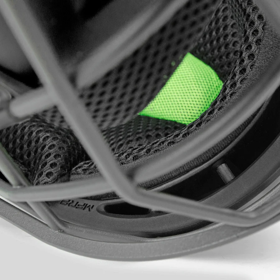 Close-up of the inside padding and metal face cage on the All Star MVP Pro Hockey Style Catcher's Helmet: MVP5, featuring black mesh fabric and a bright green section for comfort and protection. Premium catcher’s gear from All Star.