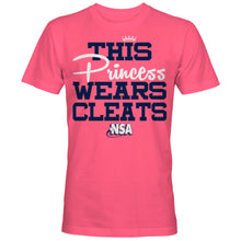 The DSG Apparel NSA This Princess Wears Cleats Short Sleeve Shirt features bold blue and white lettering with a crown above "Princess"—a perfect pink top for National Softball Association fans.