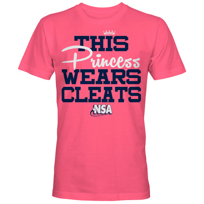 The DSG Apparel NSA This Princess Wears Cleats Short Sleeve Shirt features bold blue and white lettering with a crown above "Princess"—a perfect pink top for National Softball Association fans.