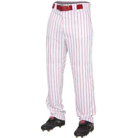 A person wears Rawlings Youth Premium Pinstripe Baseball Pants (YPIN150) in white with red pinstripes, a matching red belt, and black cleats, shown from the waist down. These pants feature 2-way stretch polyester for comfort and performance.