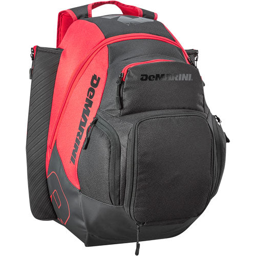 The DeMarini Voodoo OG Backpack (WB57117) is a black and red baseball backpack featuring multiple zippered compartments, a padded handle, and side pockets, shown upright against a white background.