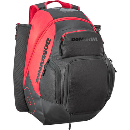 The DeMarini Voodoo OG Backpack (WB57117) is a black and red baseball backpack featuring multiple zippered compartments, a padded handle, and side pockets, shown upright against a white background.