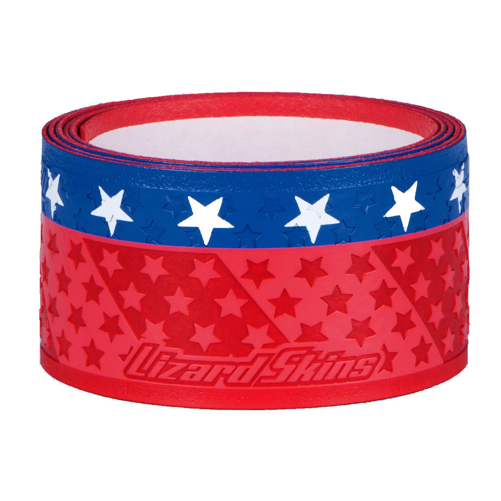 A roll of Lizard Skins Specialty 1.1mm Durasoft Polymer Bat Grip in a red and blue design features embossed stars and the Lizard Skins logo on the red section.
