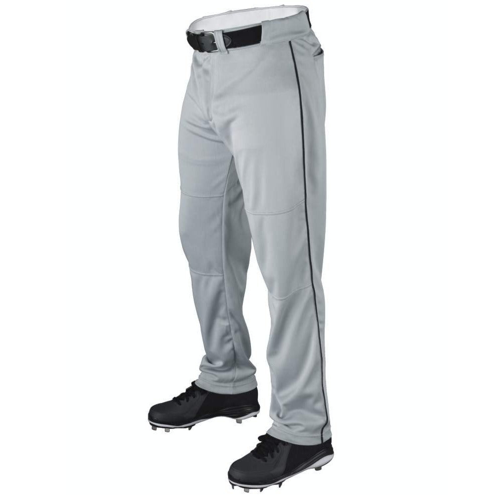 A person wearing Wilson Youth P200 Classic Knit Relaxed Fit Baseball Pants with black piping, a black belt, and black cleats. These Wilson pants have an elastic waistband and relaxed fit, shown against a plain white background.