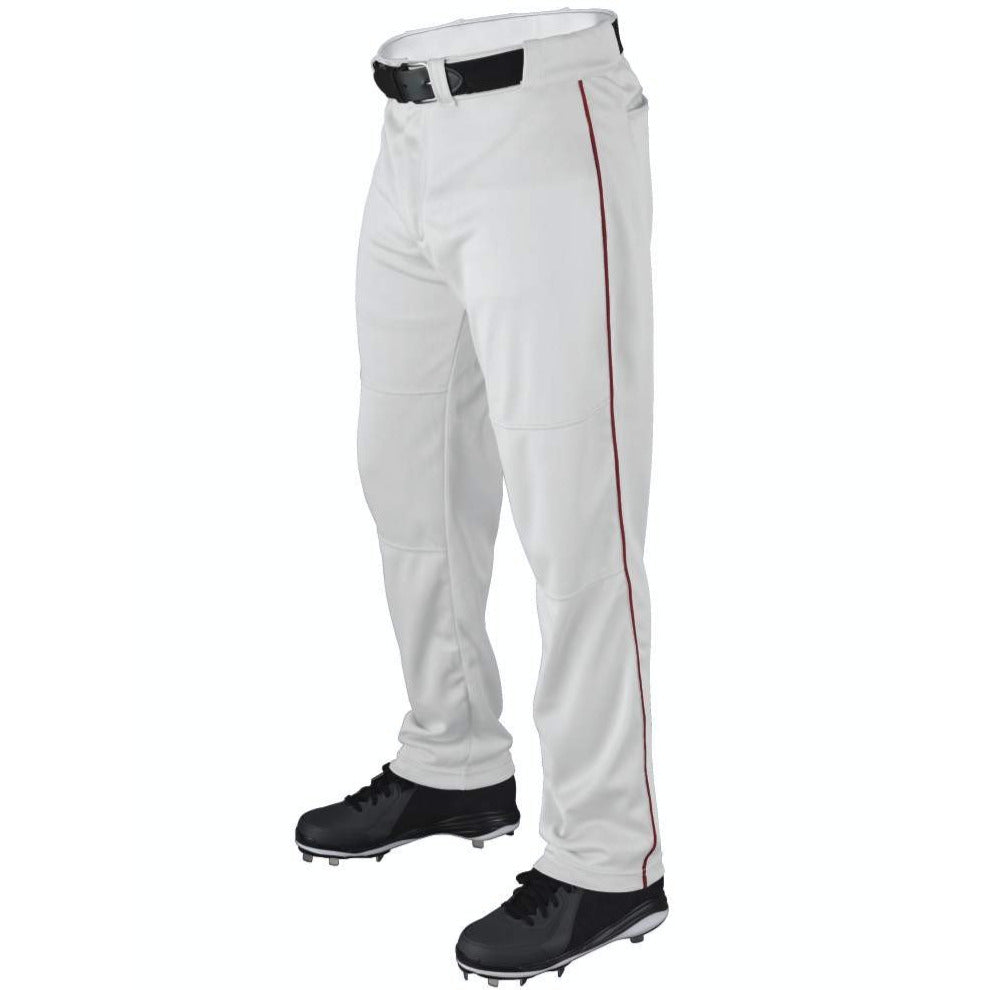 A person wearing Wilson Youth P200 Classic Knit Relaxed Fit Baseball Pants with red piping, an elastic waistband, black belt, and black cleats. The photo is cropped from the waist down against a white background.