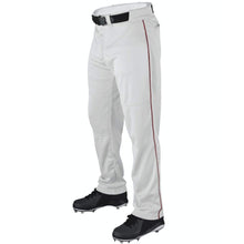 A person wearing Wilson Youth P200 Classic Knit Relaxed Fit Baseball Pants with red piping, an elastic waistband, black belt, and black cleats. The photo is cropped from the waist down against a white background.