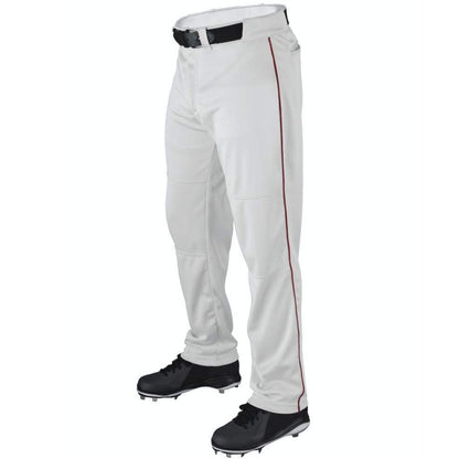 A person wearing Wilson Youth P200 Classic Knit Relaxed Fit Baseball Pants with red piping, an elastic waistband, black belt, and black cleats. The photo is cropped from the waist down against a white background.