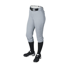 Wearing DeMarini Girl's Belted Fastpitch Softball Pants (WTD4040) in gray, with a black belt, knee-high socks, and cleats, a person stands against a white background; upper body not visible.