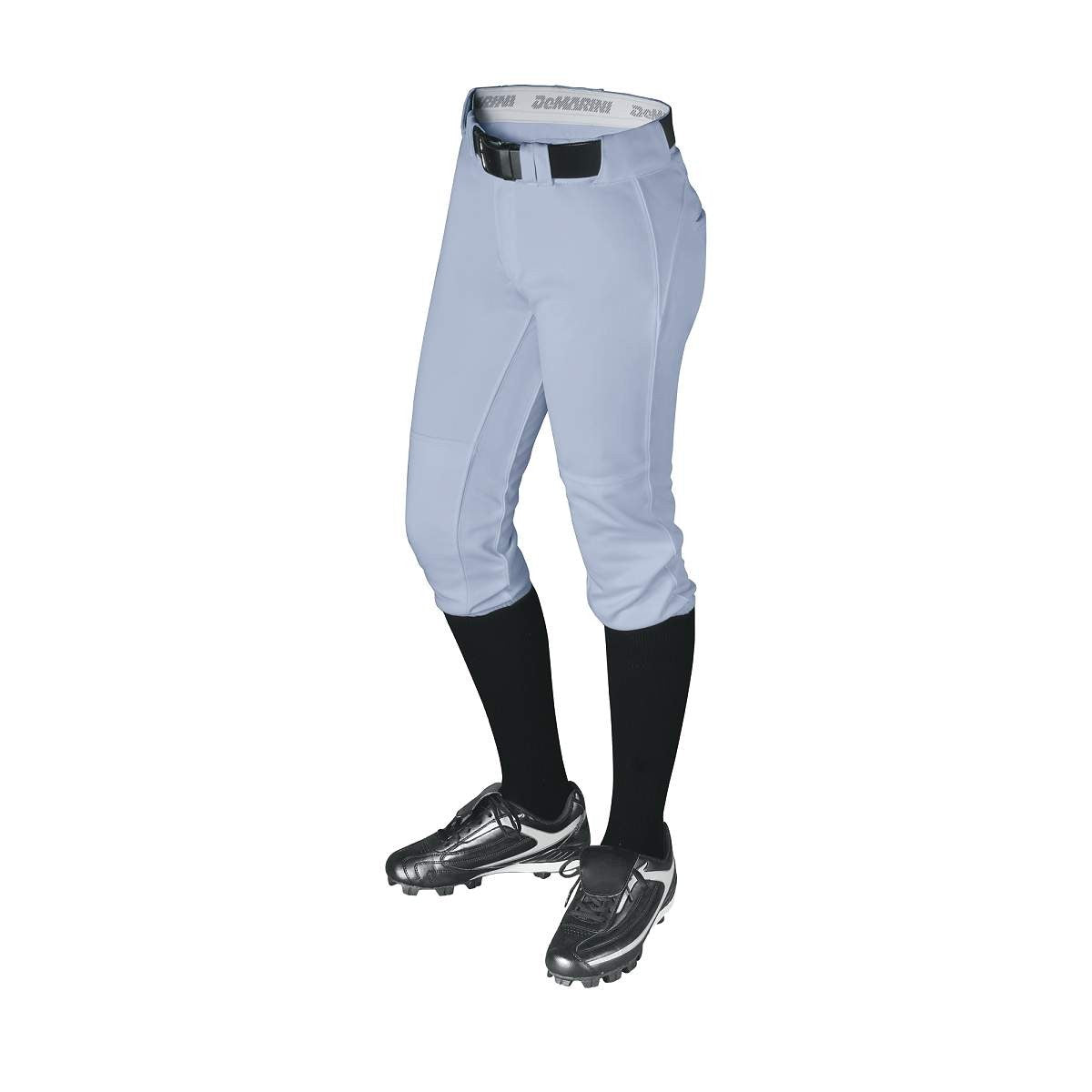 A person wears light gray DeMarini Women's Uprising Fastpitch Softball Pants (WTD3077) with a black belt, black knee-high socks, and silver baseball cleats, shown waist to feet against a white background.
